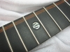 Black Pearl Moses 'M' inlay with wood detail at 12th fret